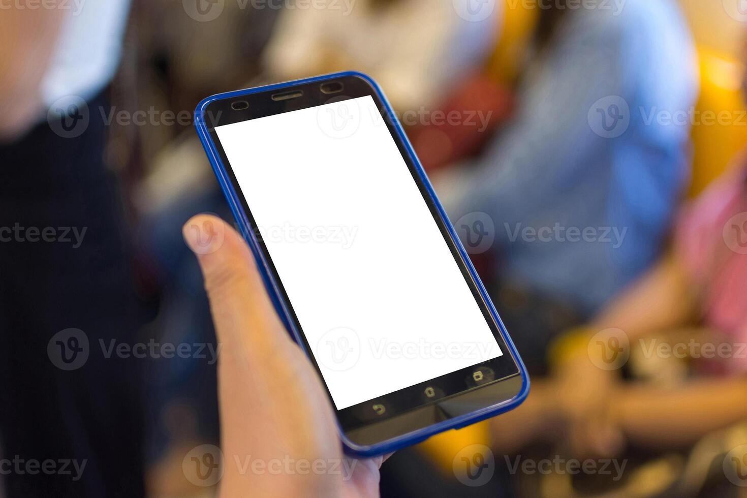 A person holding a smart phone with a blank screen photo
