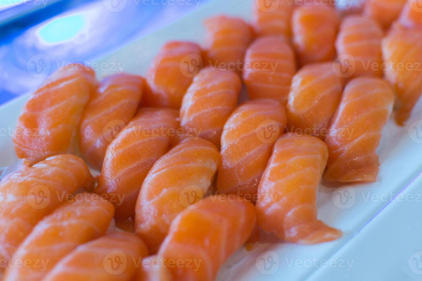 A plate of sushi with a variety of different types of fish photo
