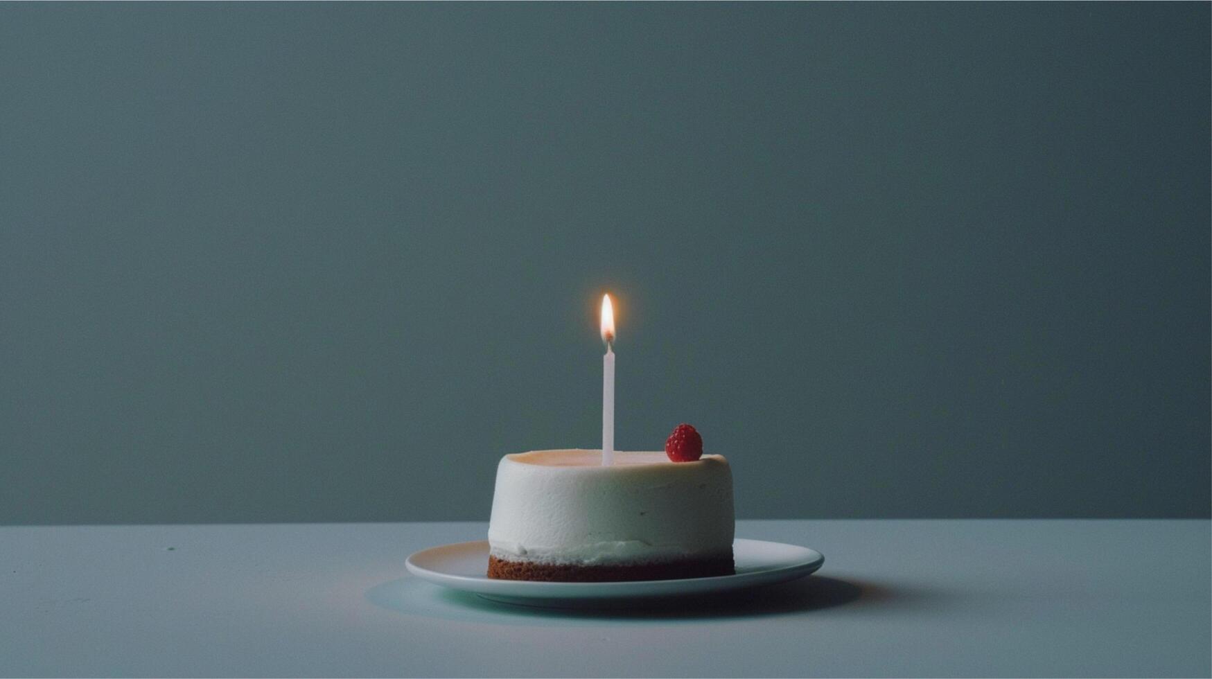 Glowing birthday candles cast a romantic flame on a dark background, a beautiful decoration for any celebration photo