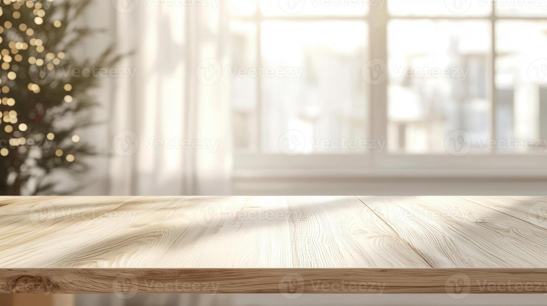 Christmas themed product placement background featuring a white table, candles, snowy pine branch, and a blurred christmas tree with bokeh lights photo