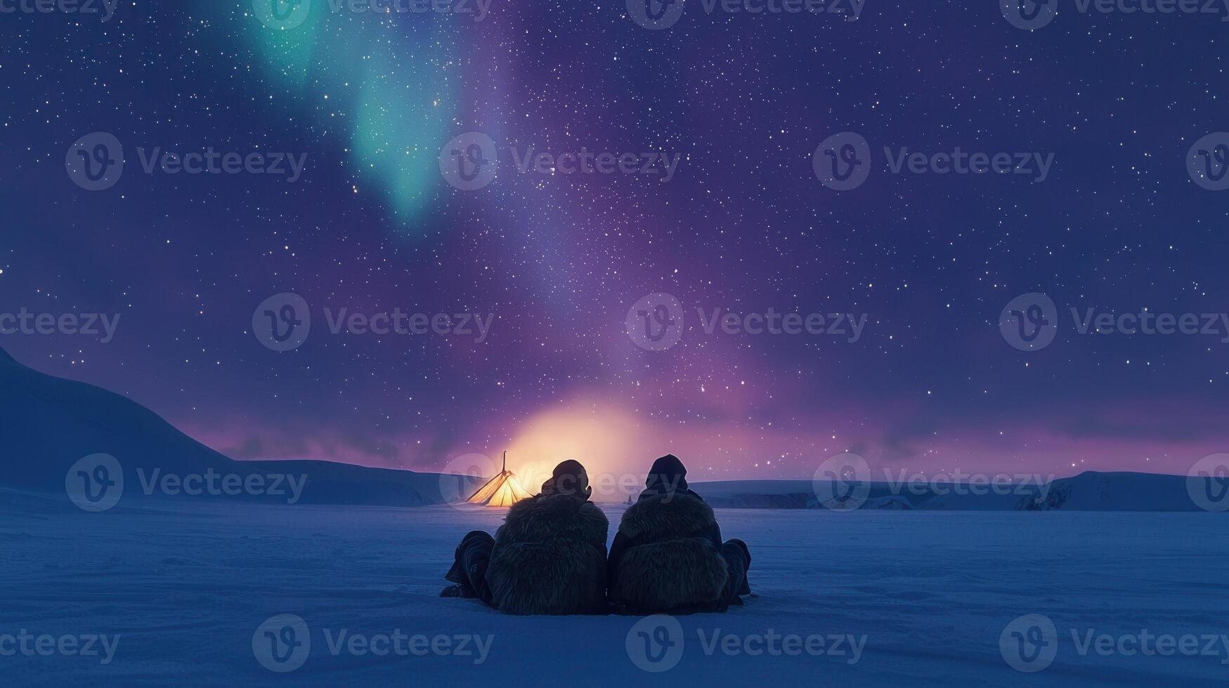Aurora borealis over snowy landscape photo
