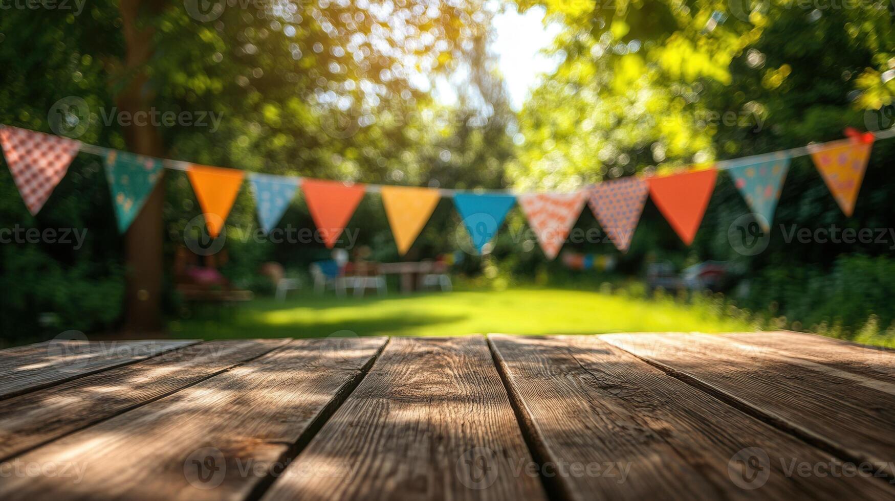 Wooden table top with colorful party flags hanging on trees in a garden, perfect for displaying products photo