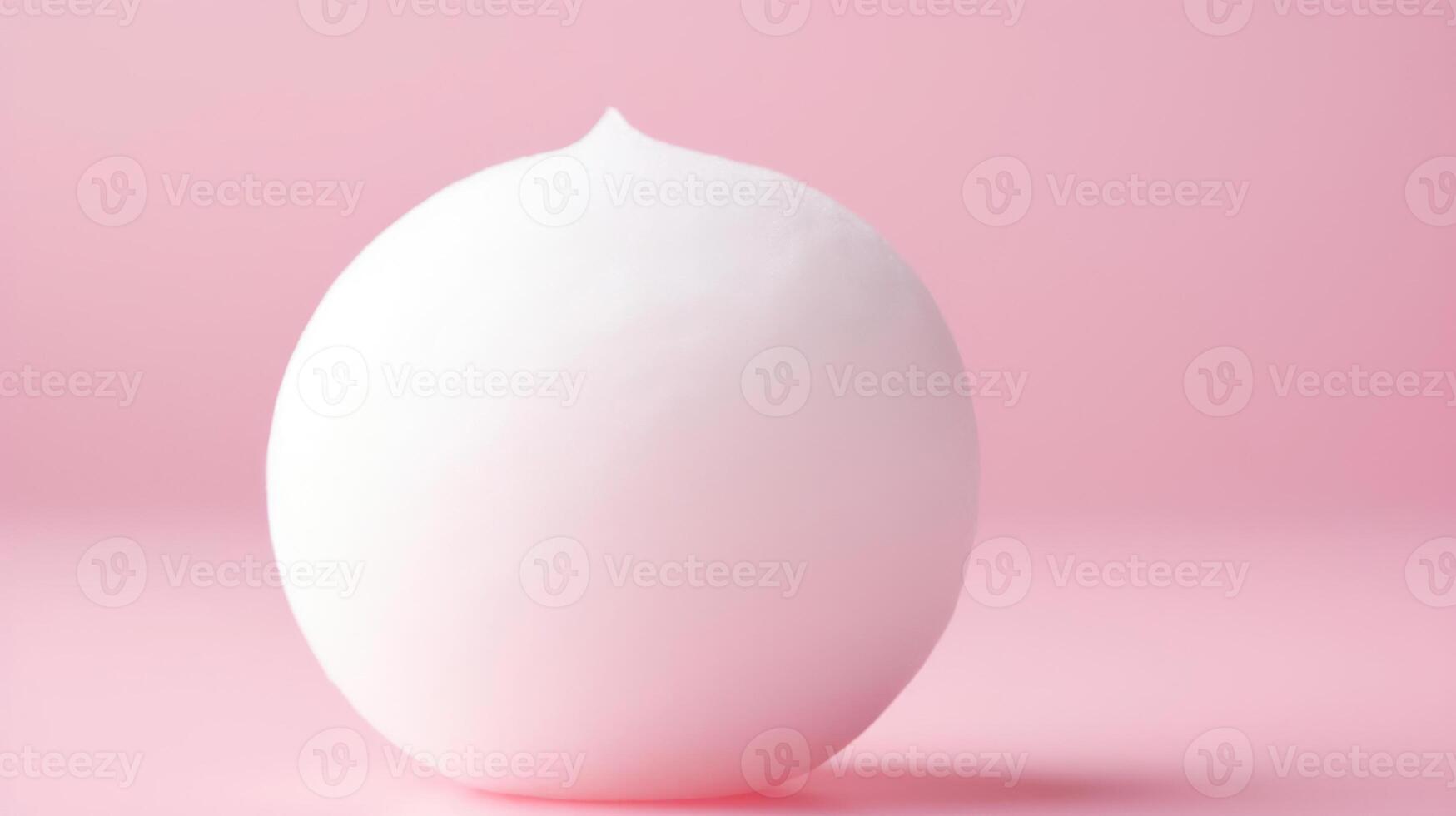 Minimalist pink background with a white sphere. photo