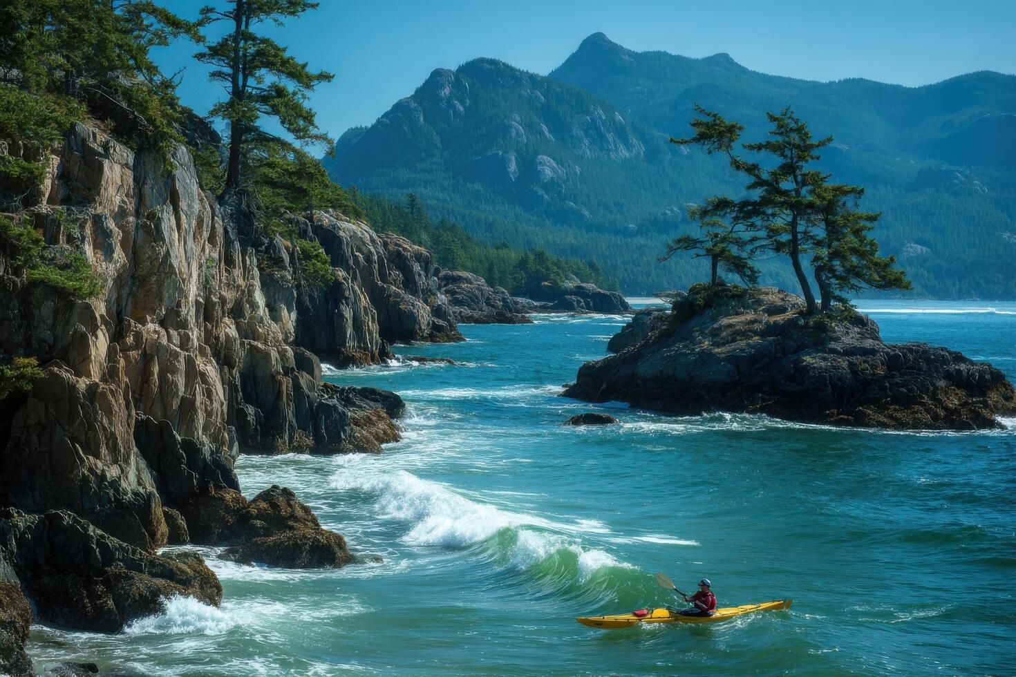 A kayaker paddles through the ocean near rocky cliffs photo
