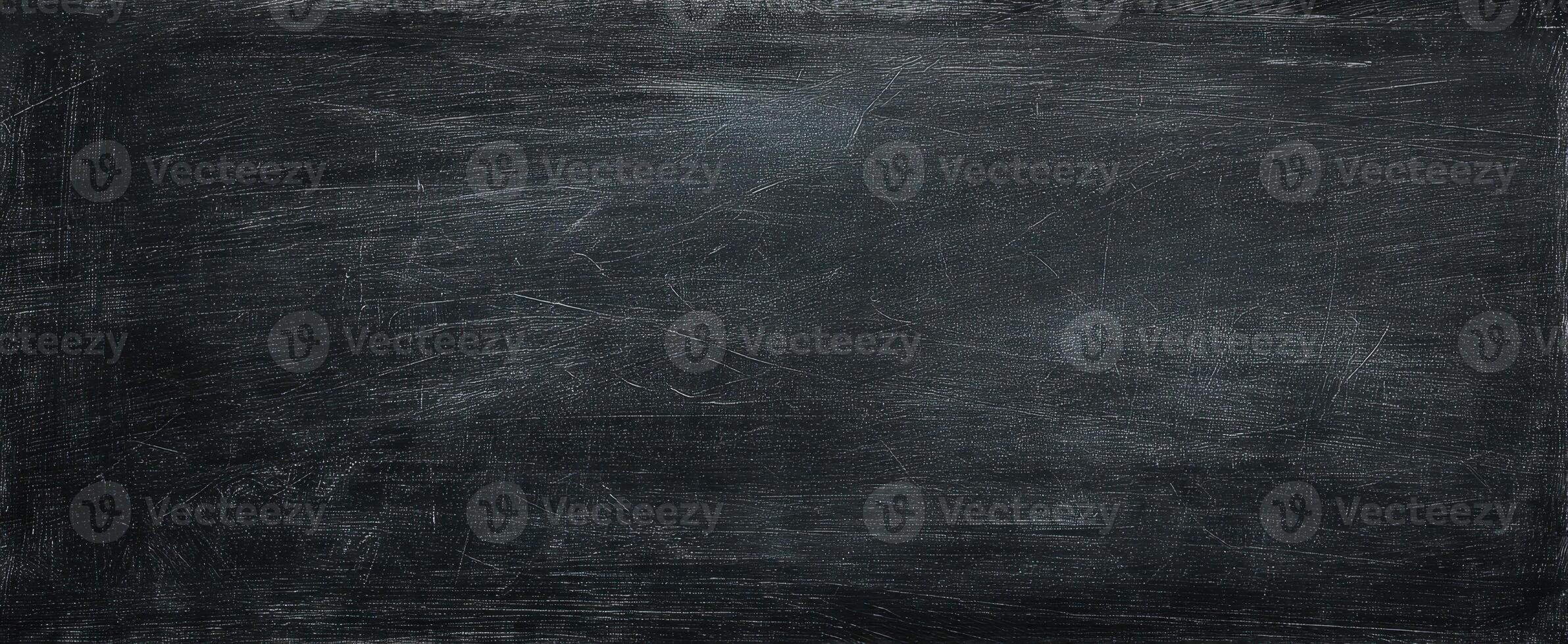 The textured black surface providing a perfect backdrop for creativity and design. photo