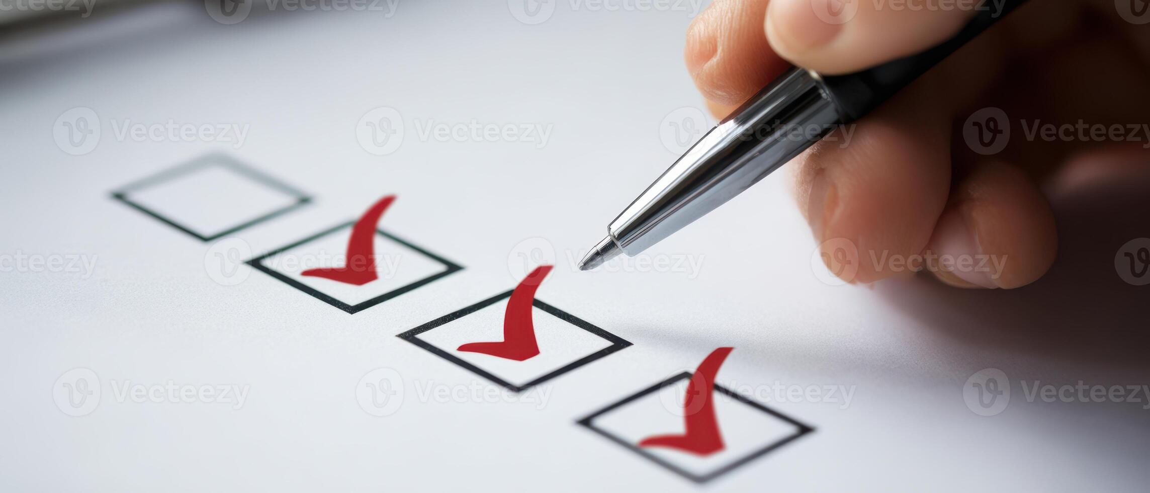 The pen marking checkboxes on a productivity checklist for task completion. photo