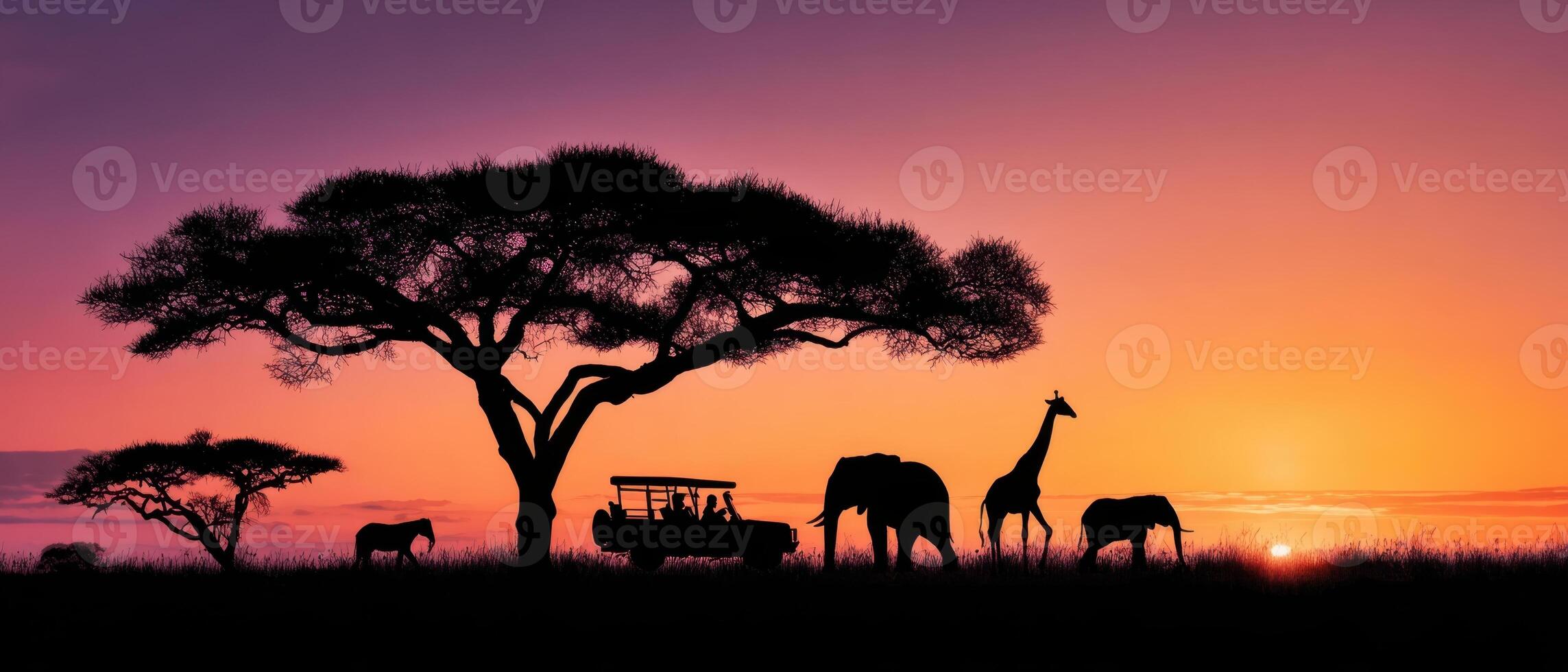 The majestic elephants and giraffes against a vibrant sunset silhouette. photo