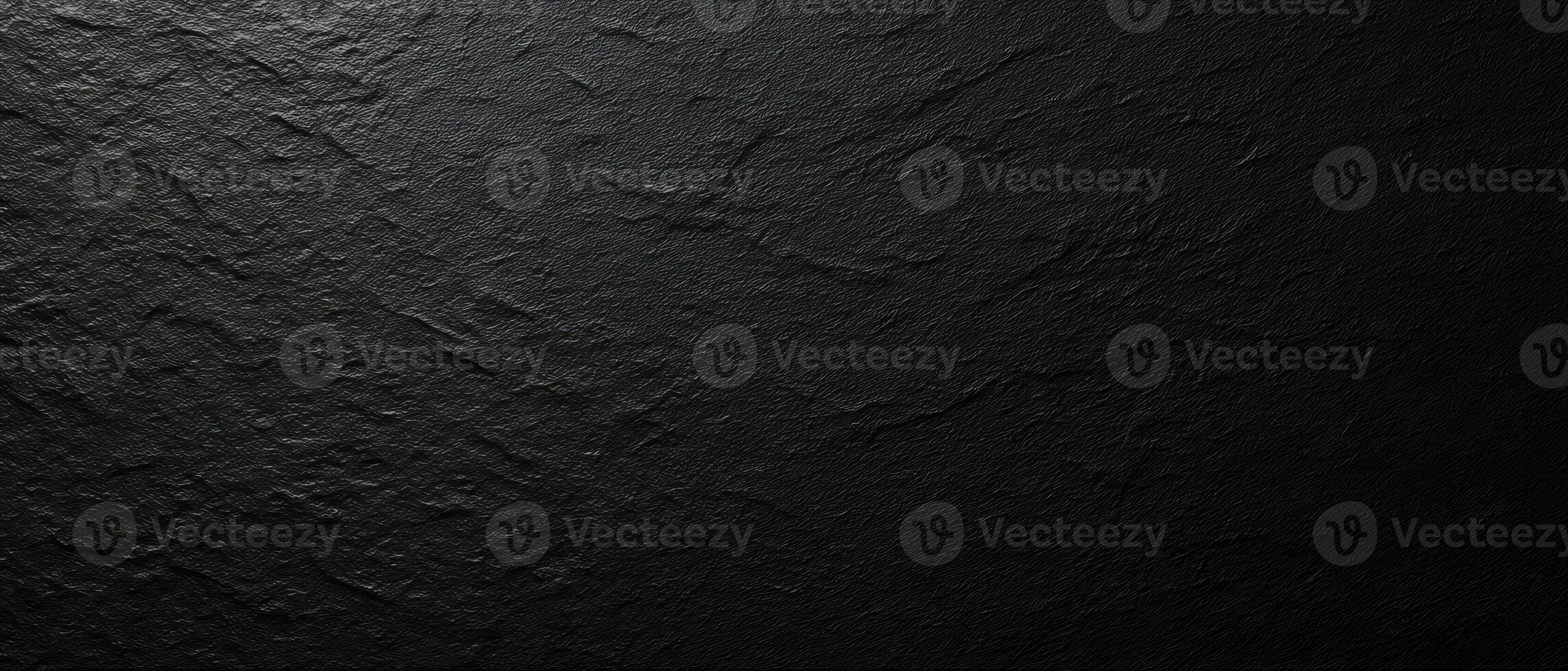 The textured black surface emphasizing minimalist elegance and modern design. photo