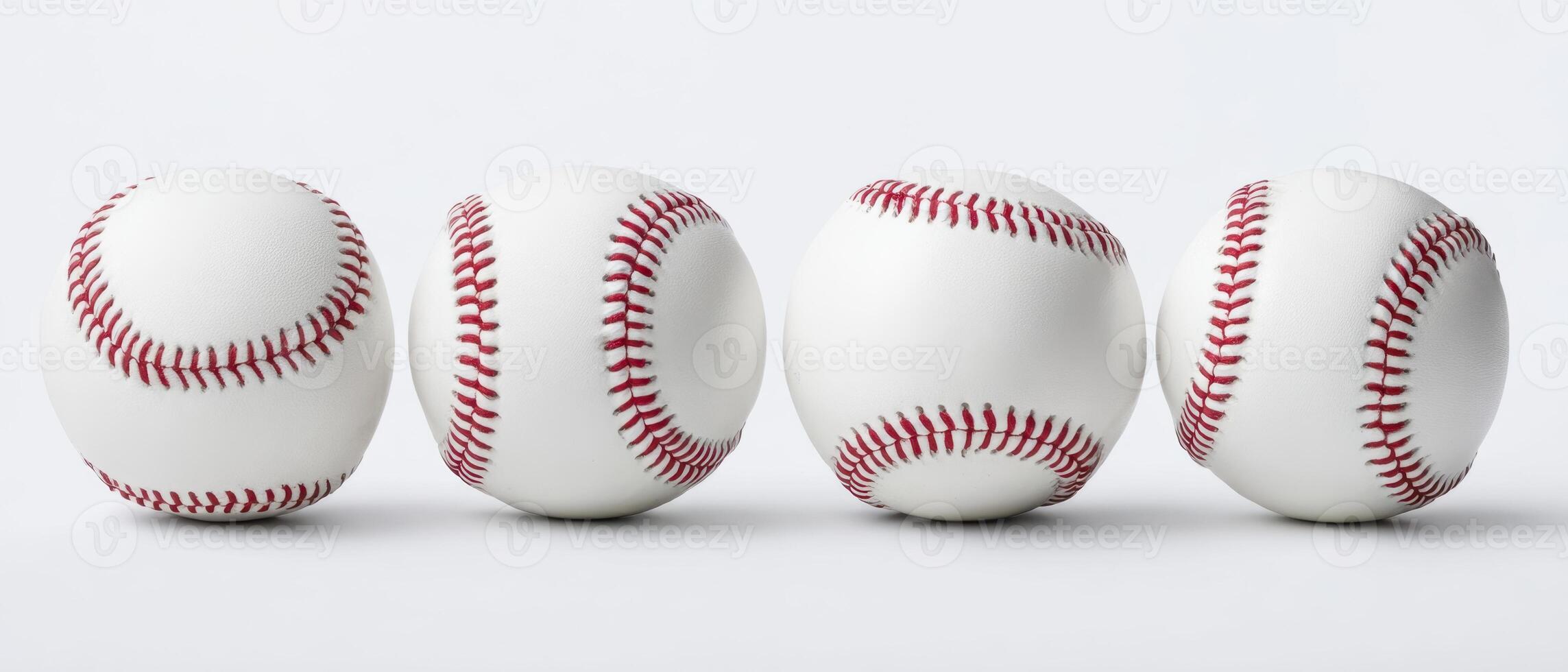 The baseballs arranged in a dynamic sequence showcasing their design and texture. photo