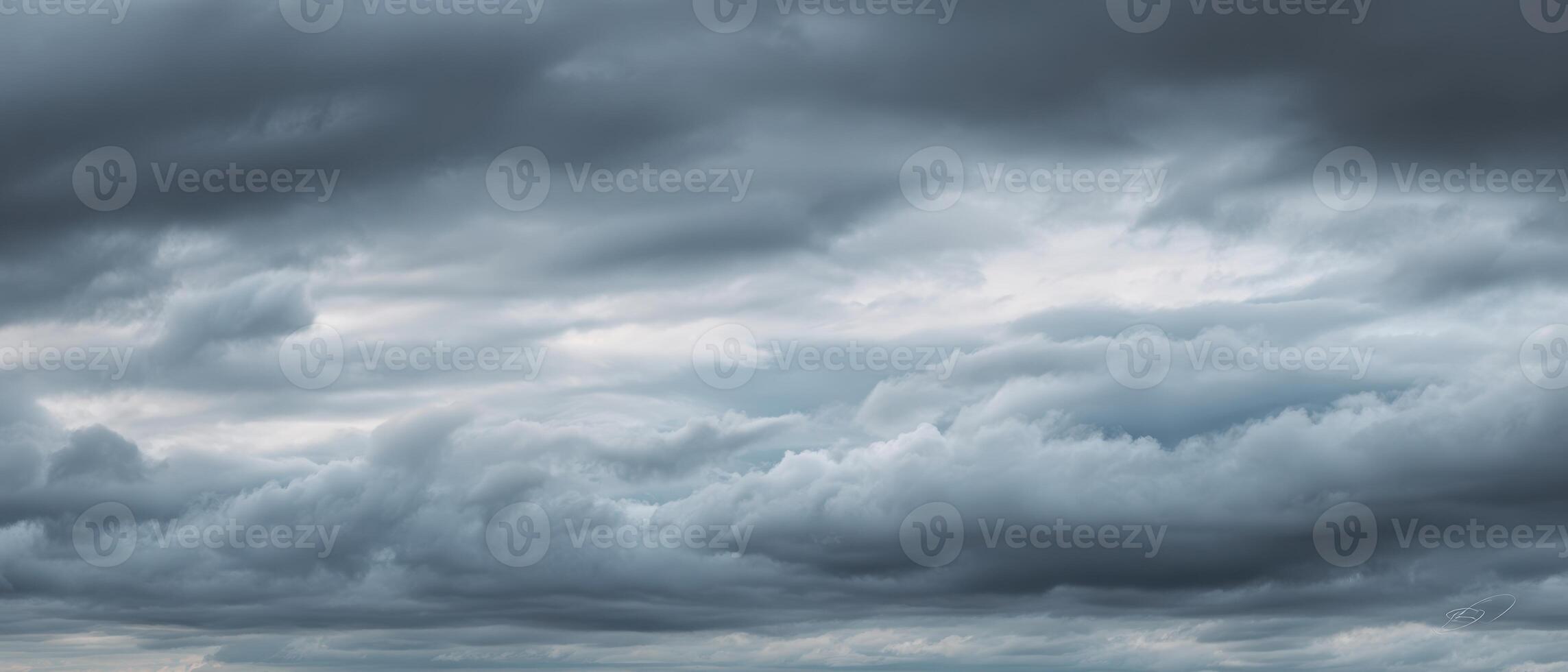 The Dramatic Clouds Overcast a Serene Horizon in a Moody Landscape. photo