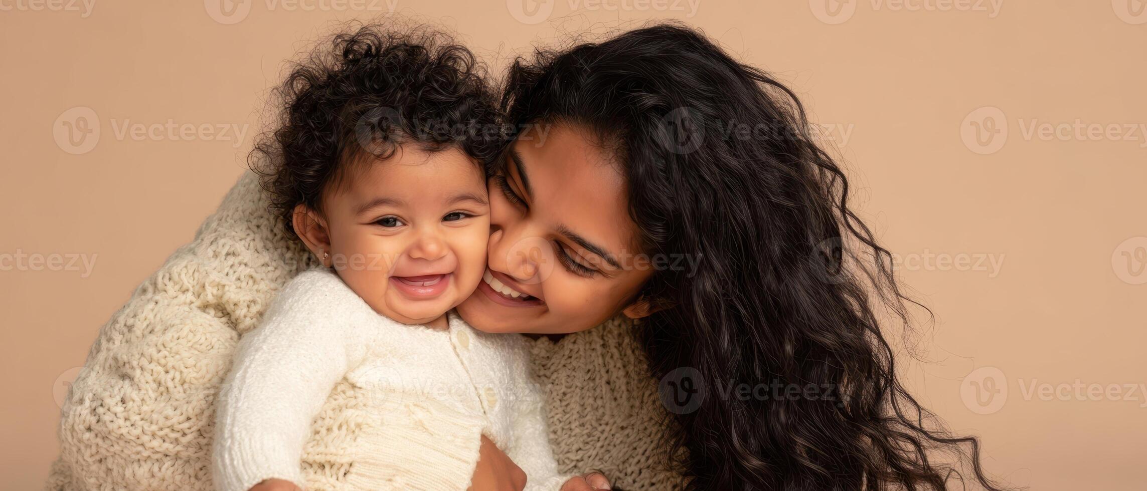 The joyful moment of a mother embracing her smiling baby. photo