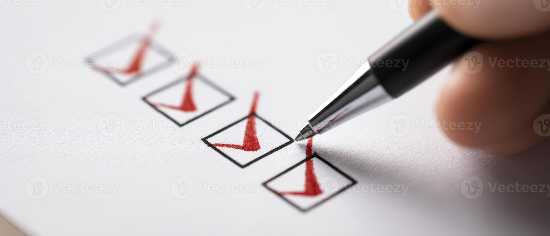 The checklist being marked with a pen in a close-up photo. photo