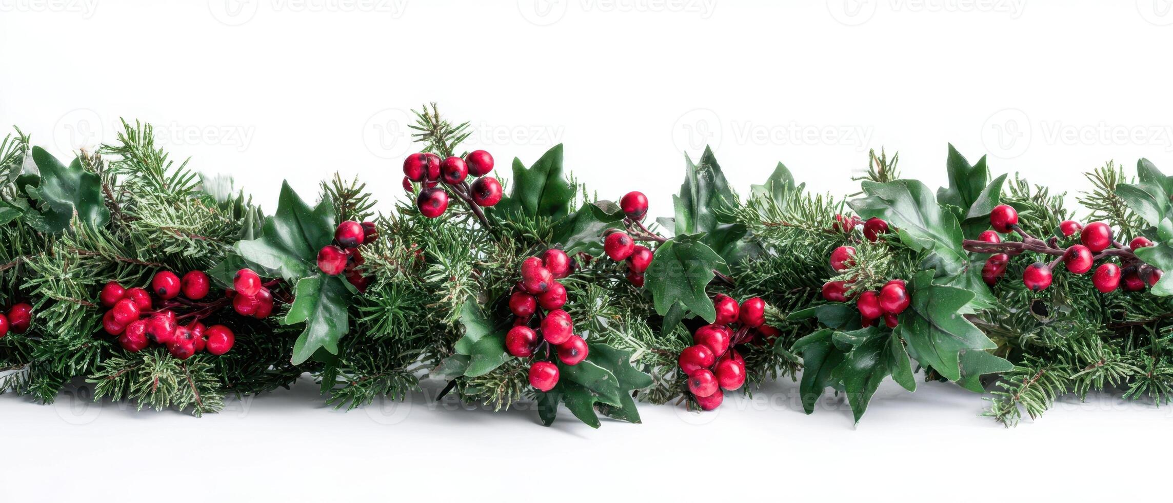 The vibrant holiday garland adorned with red berries and green foliage. photo