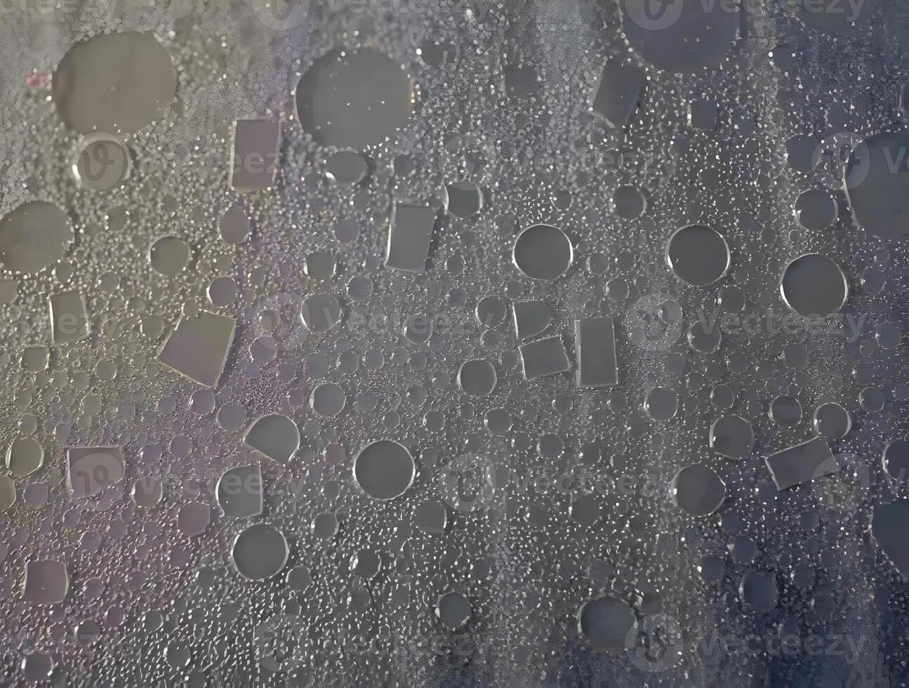 A close up of water droplets on a window photo