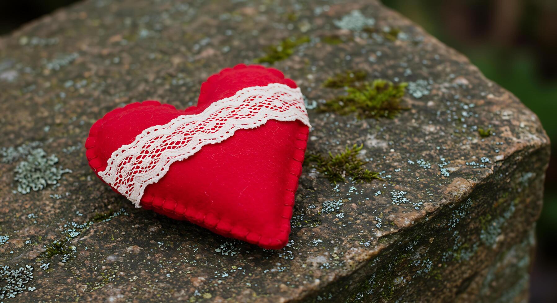 A red heart on a rock photo