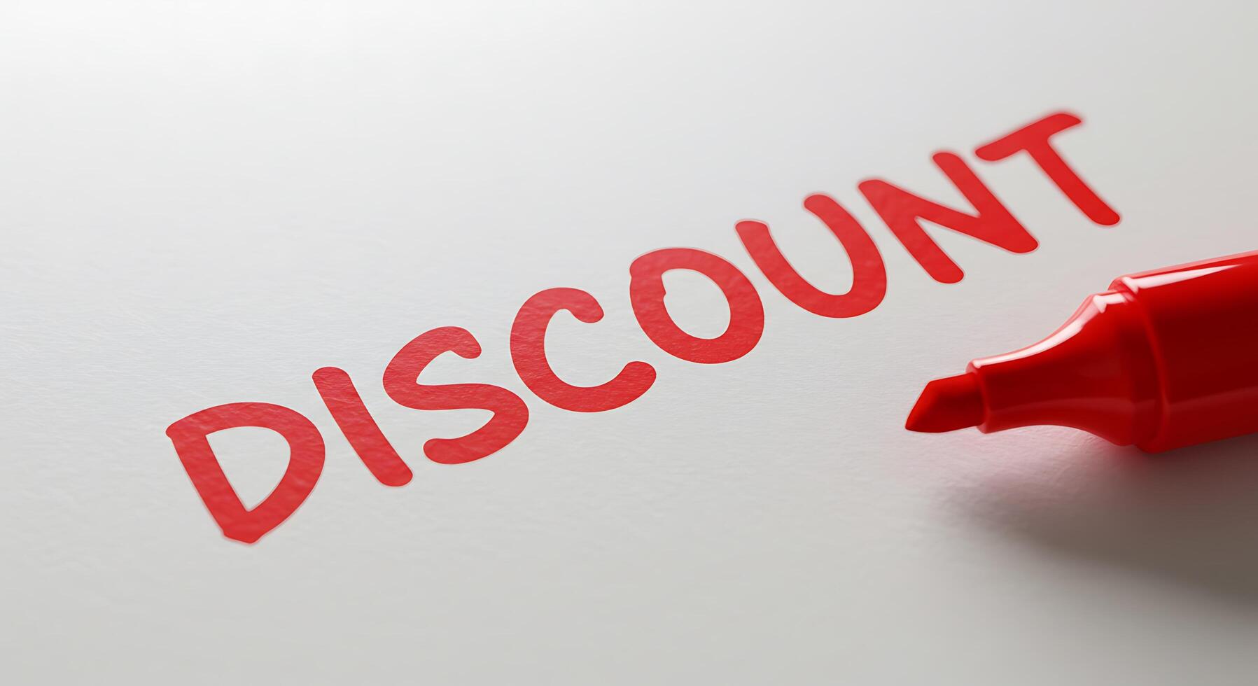 Discount word on white paper with red marker photo