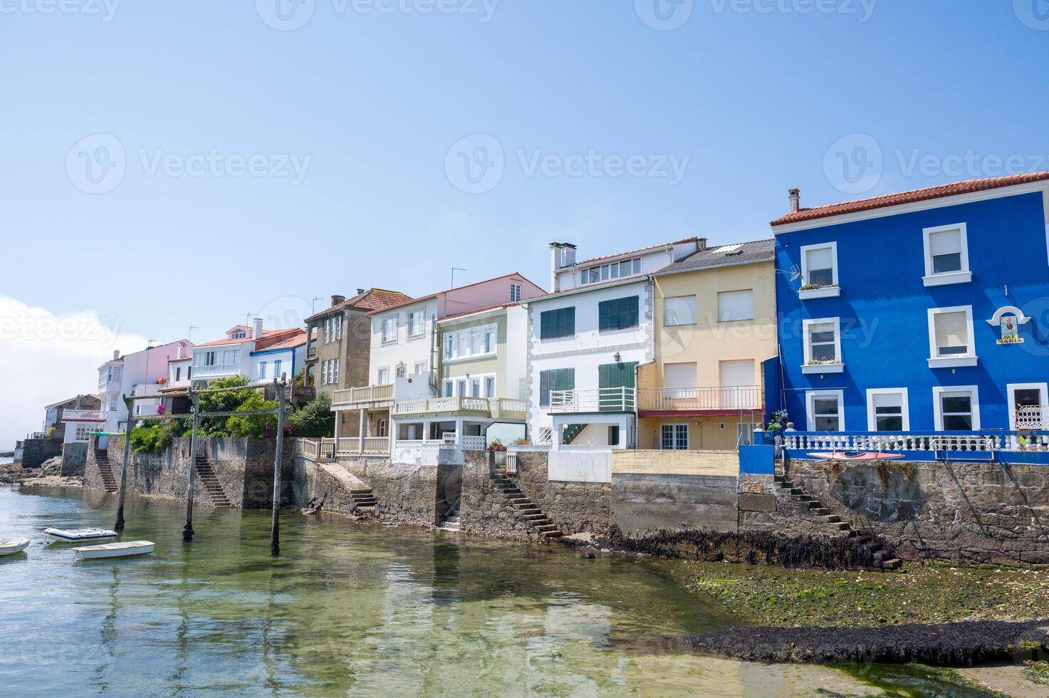 Small fishing village with boats and beach. Redes, Galicia, Spain. photo