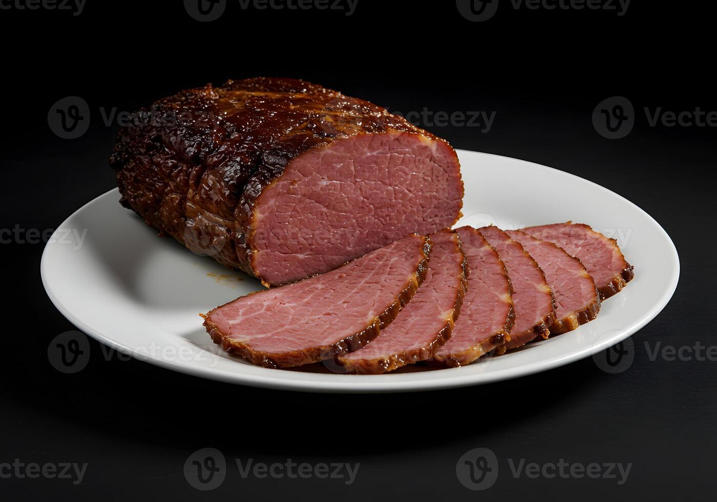 A plate with a sliced ham on it photo