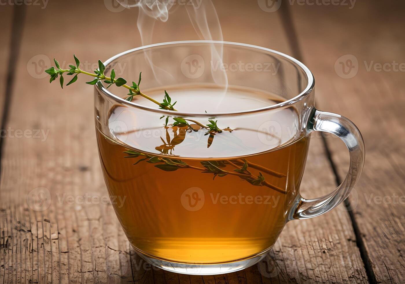 A cup of tea with a sprig of thyme photo