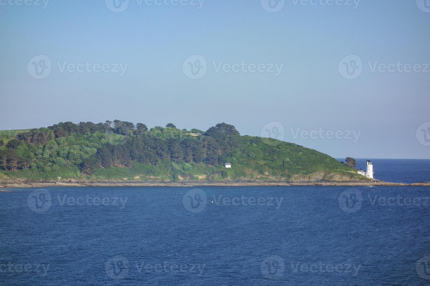 lighthouse at cornwall coast photo