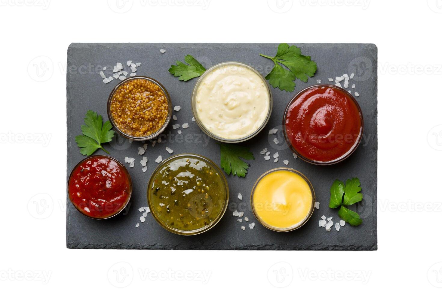Many different sauces and herbs isolated on white background, flat lay top view. sauces on plate, photo