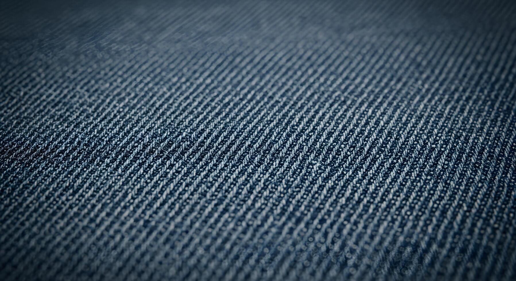 Detailed denim fabric texture in a close-up shot, ideal for background use in apparel design, advertising, or digital branding. photo