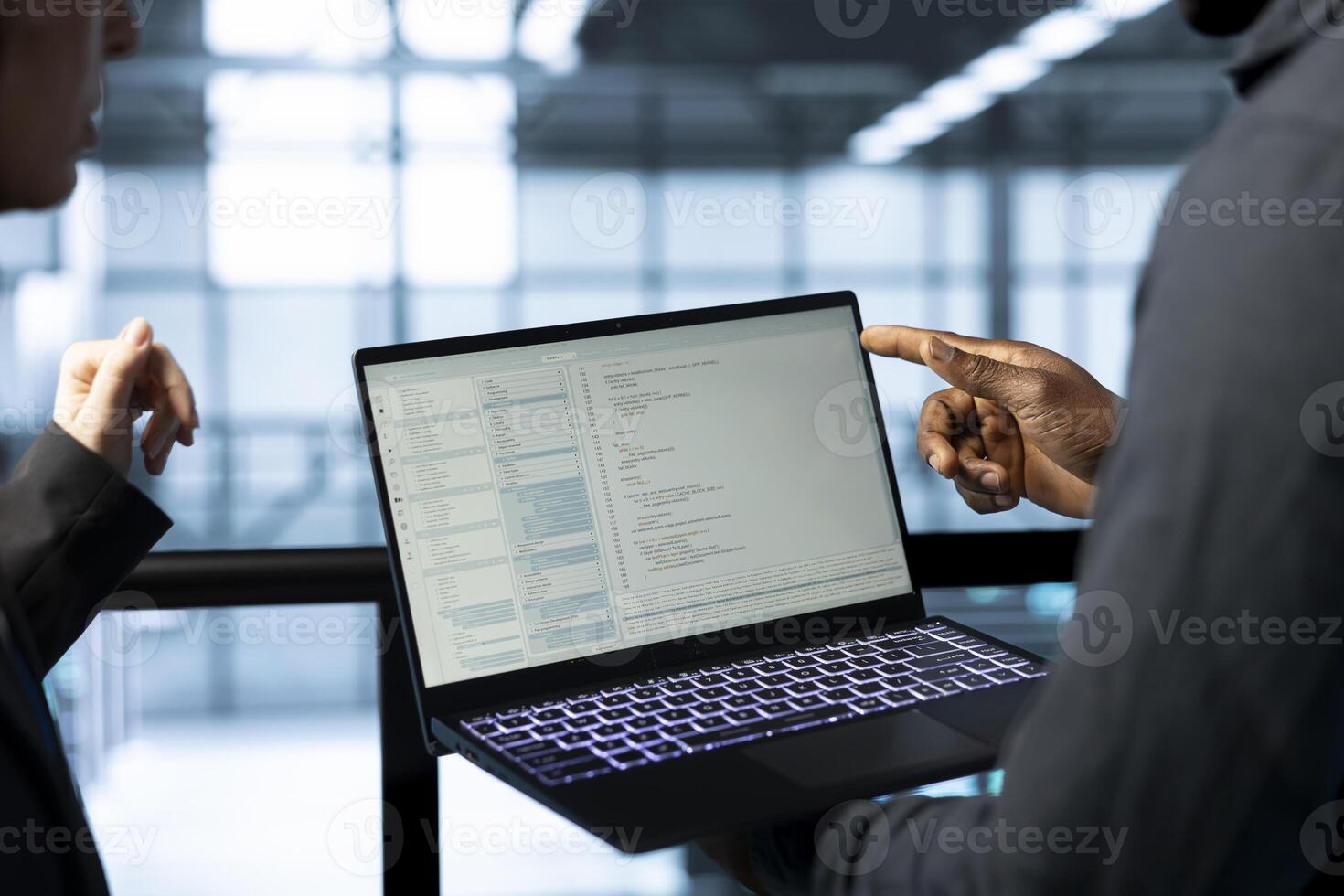 Software developers in data center using laptop, employing machine learning models. Close up of workers using notebook to fulfill infrastructure needs, allocating resources efficiently photo