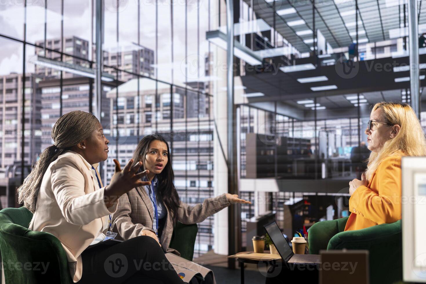 Diverse women executives in a modern office discussing business growth, career development and gender equality. Powerful leaders in action uniting forces to expand the enterprise, progression. photo