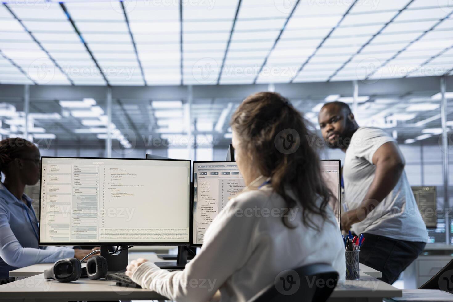 Computer scientist in data center office uses artificial intelligence neural networks doing computing processes. IT specialist working on PC with AI machine learning algorithms photo