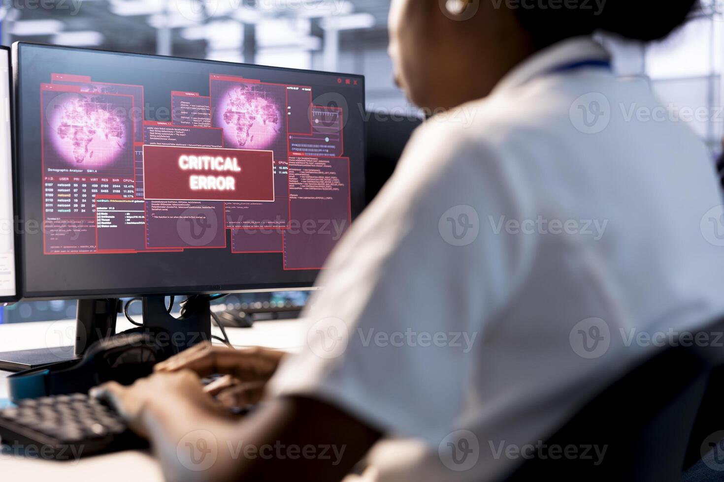 Computer scientist in server hub investigating breach alerts, working to protect infrastructure from hacker. Worker typing on PC keyboard, fixing critical error, trying to mitigate security risks photo