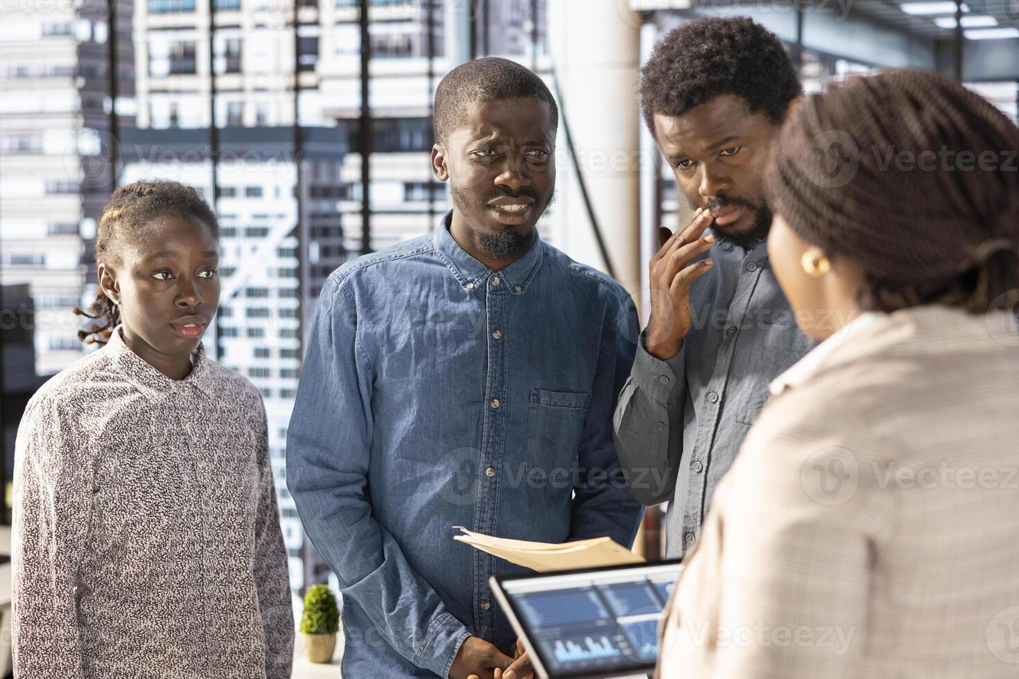 Professional team analyzing archived data on a modern device, collaborating on enterprise solutions and financial planning tasks to improve company performance and for long term growth. photo