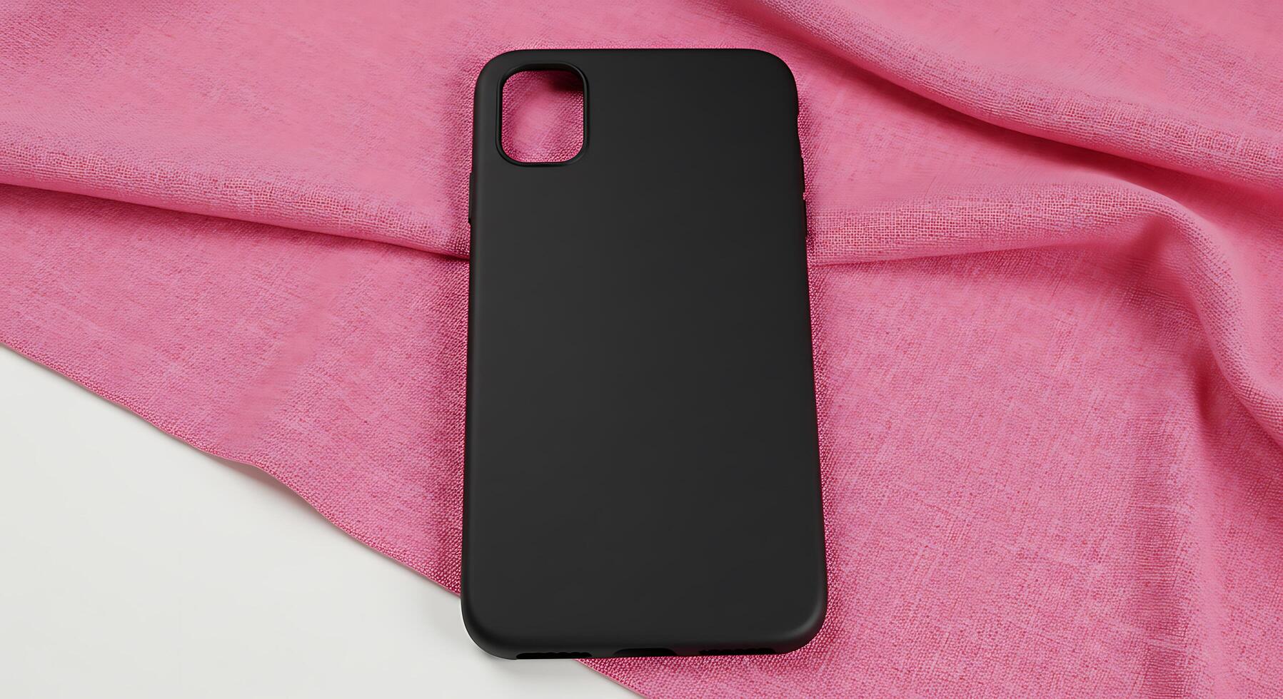 Black iphone case laying on a pink cloth photo