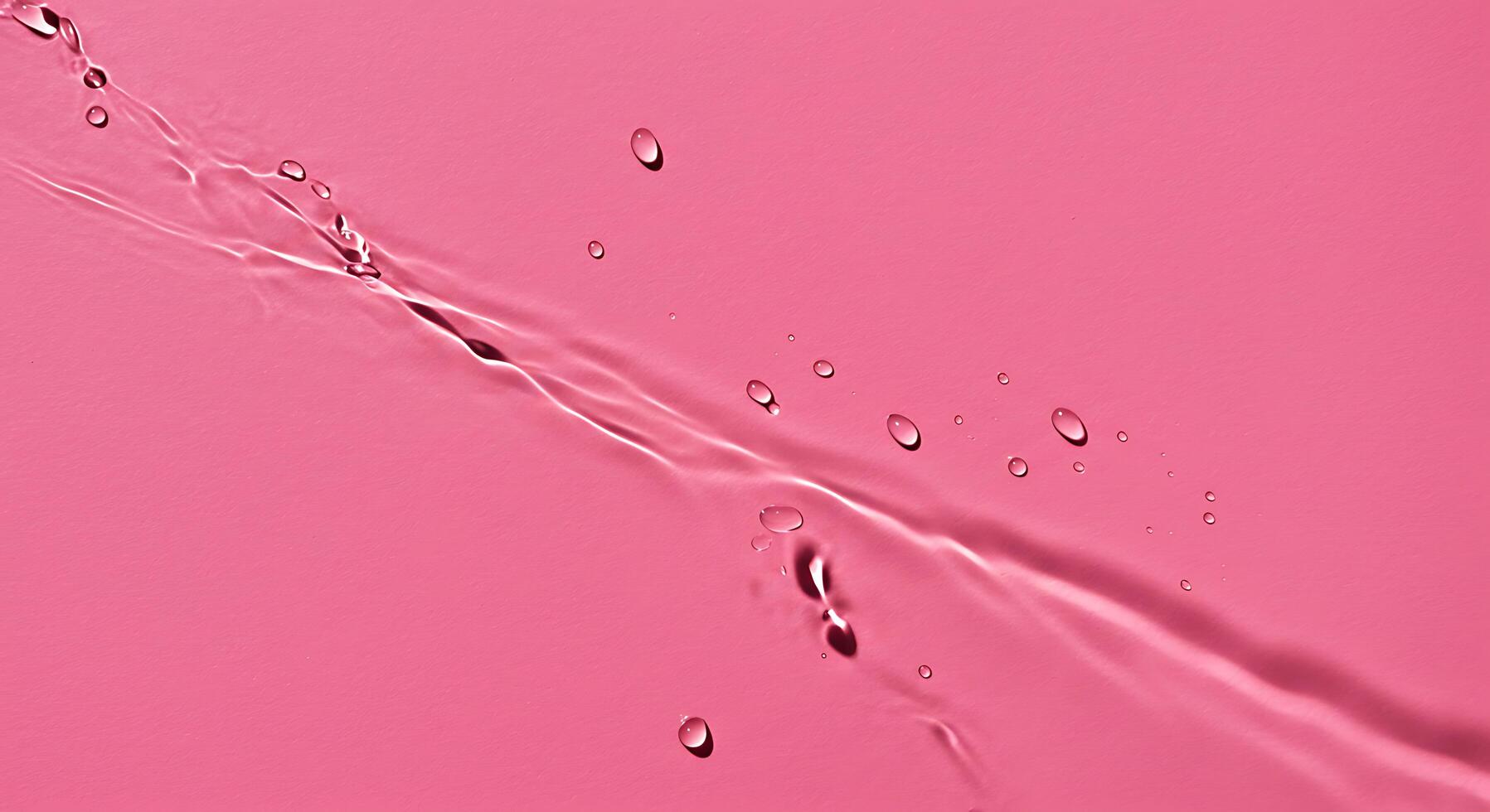 Water droplets on a pink background photo