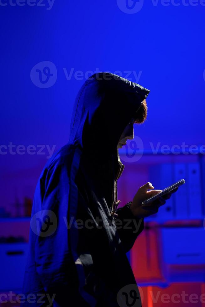 Hacker using smartphone for phishing attack and data theft photo