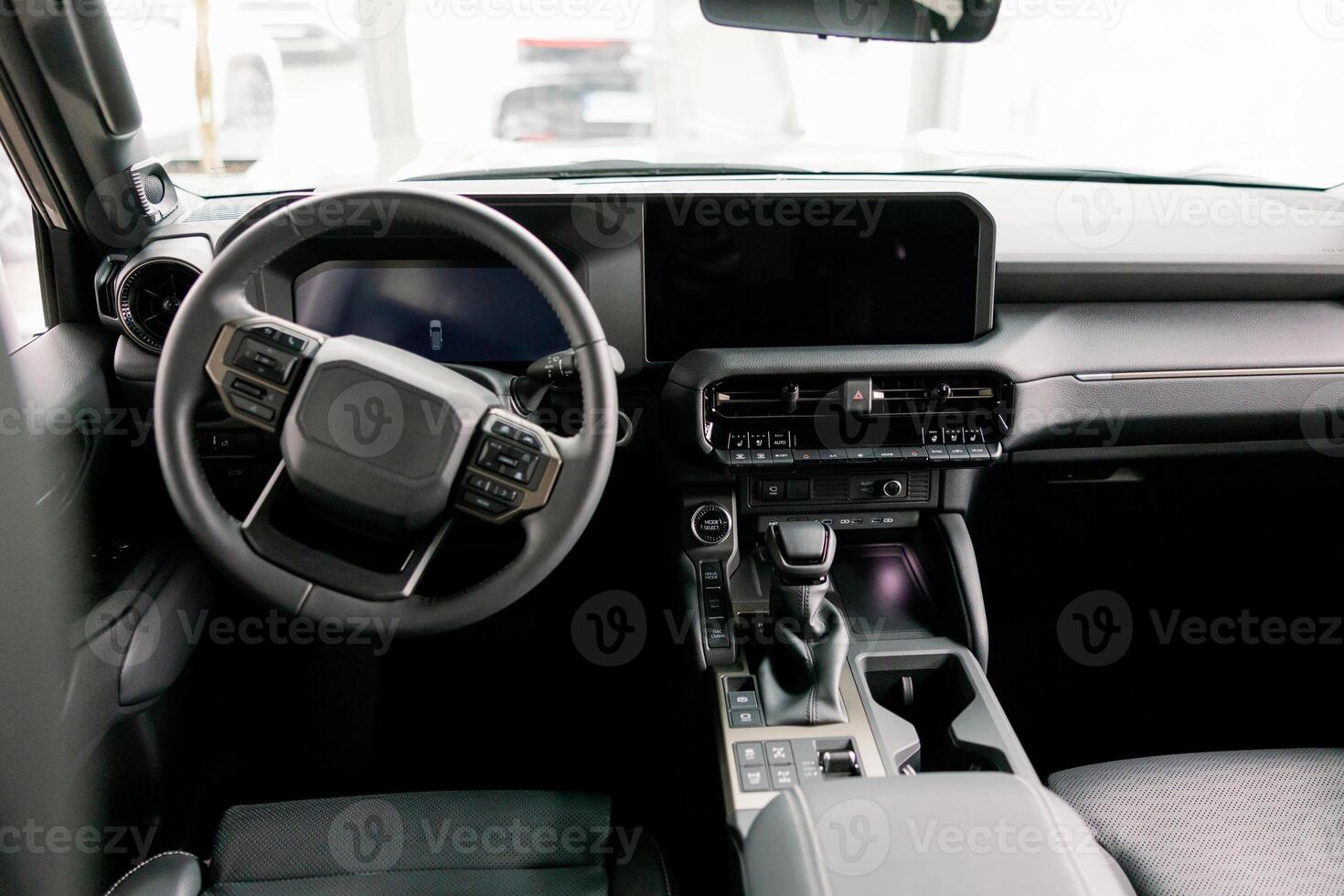 Modern Car Interior Showing Steering Wheel, Dashboard, and Leather Seats. photo