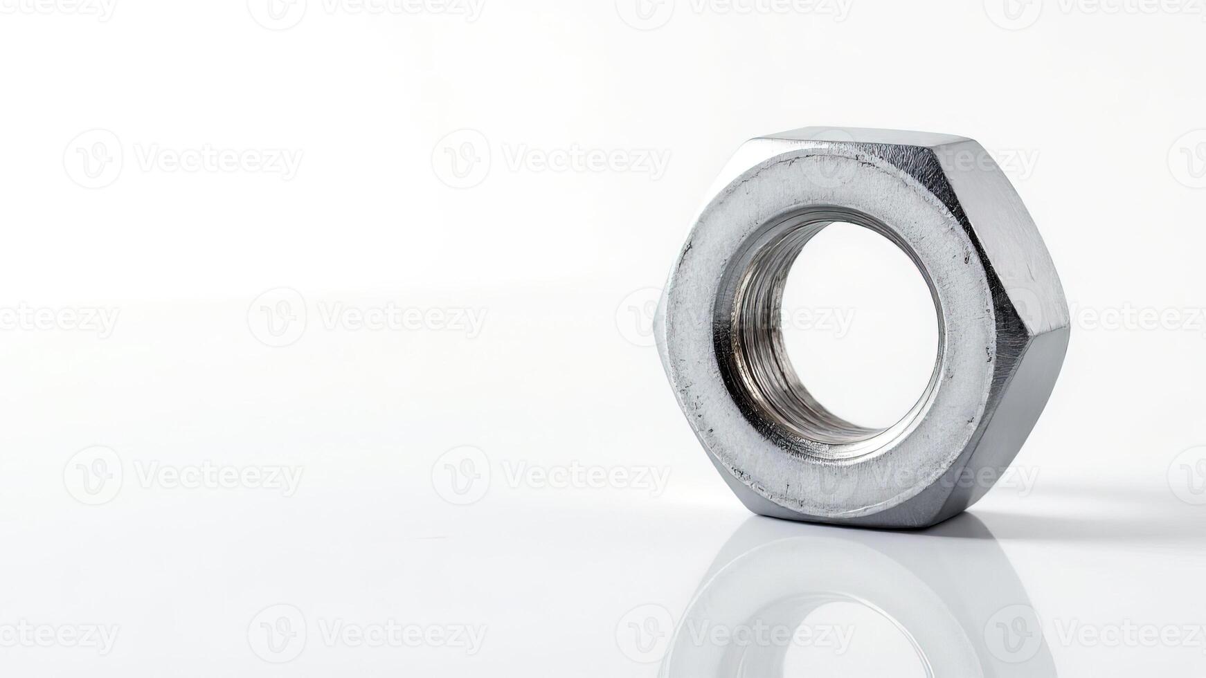Metallic Nut on White Background with Smooth Reflective Surface photo