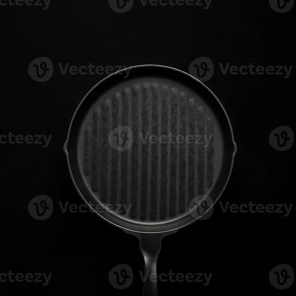 Grill Pan Centered in Dramatic Shot on a Dark Background photo