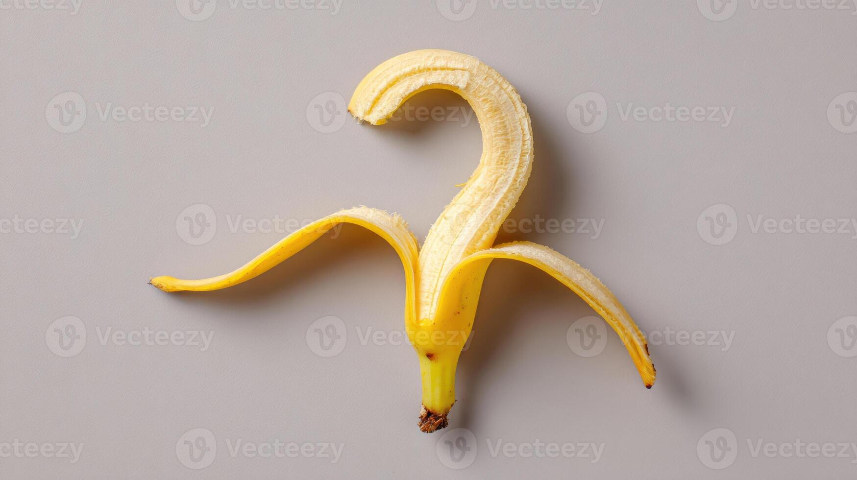Banana Peel Curls Into Whimsical Question Mark Shape, Adding Humor to Ordinary Setting photo