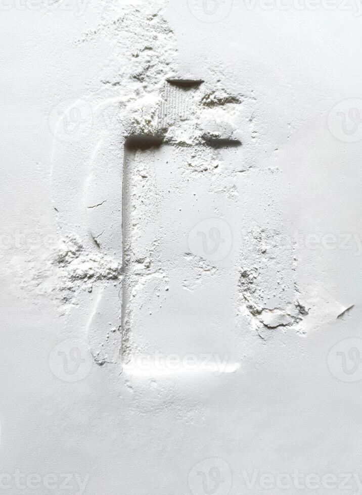 Imprint of perfume bottle on surface of sand. Perfume advertising concept photo