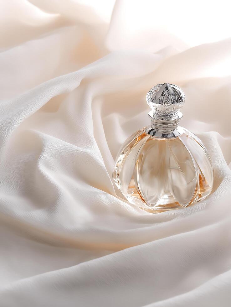 Elegant Perfume Bottle on Draped Fabric. A luxurious still life image of a beautiful perfume bottle resting on creamy silk. photo