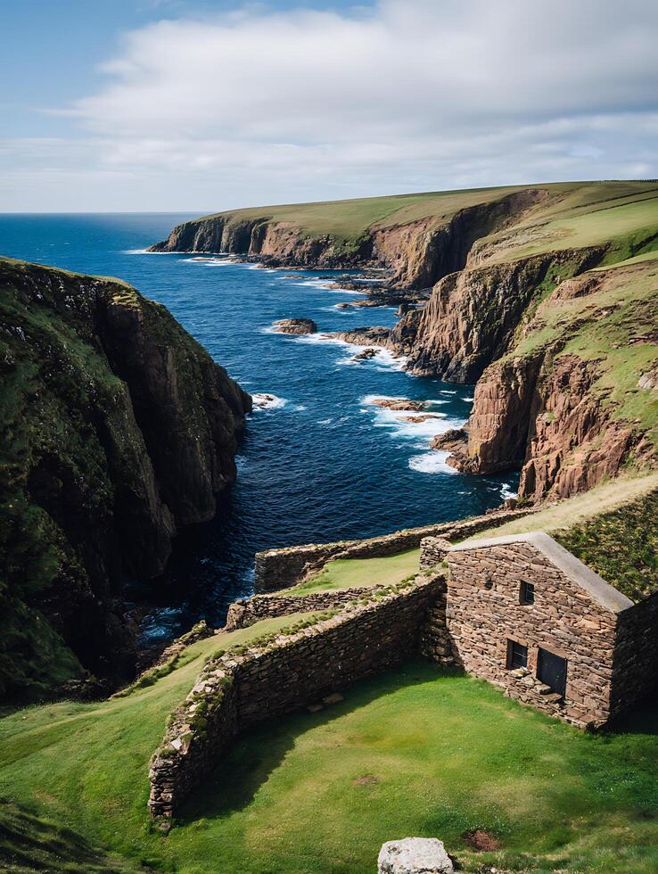 Coastal Stone Structure on Dramatic Cliffs, Scotland. A picturesque scene of a historic stone building overlooking a rugged coastline. photo