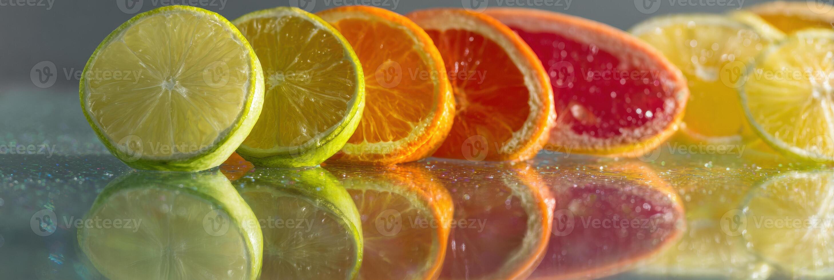 Bright Citrus Slices Create a Vibrant Display on a Glass Table With Light Reflections During Daytime photo