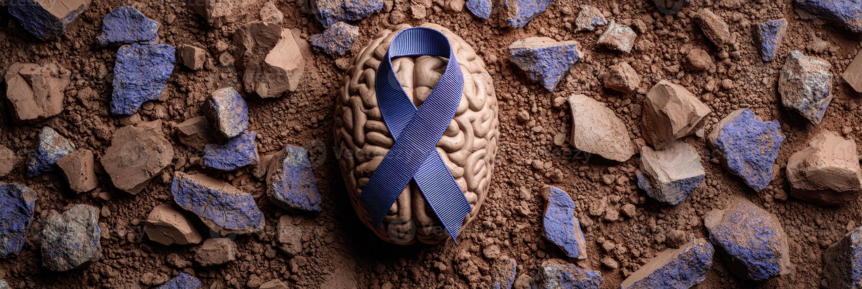 Clay Brain Sculpture Surrounded by Blue PTSD Awareness Ribbon on Textured Surface photo