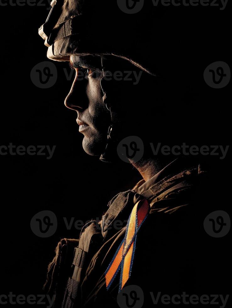 Soldier Silhouette in Shadows Highlighting Support Ribbon During Emotional Tribute photo