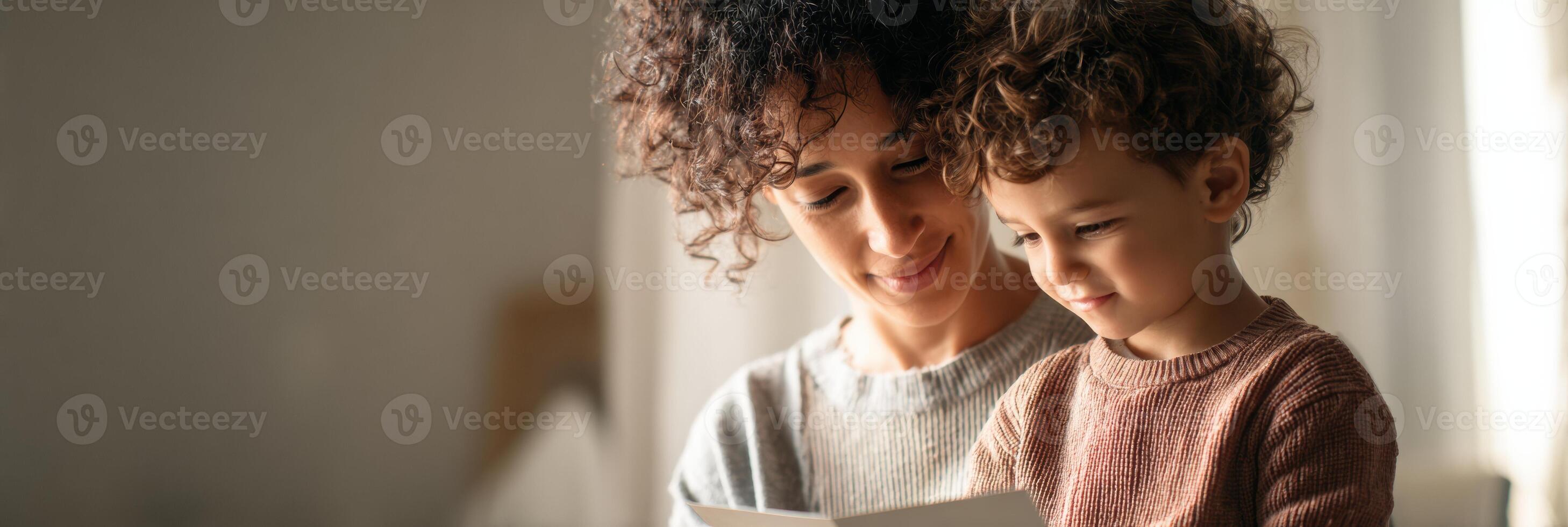 Parent and Child Engage in Communication Through Picture Cards in Soft Natural Light photo