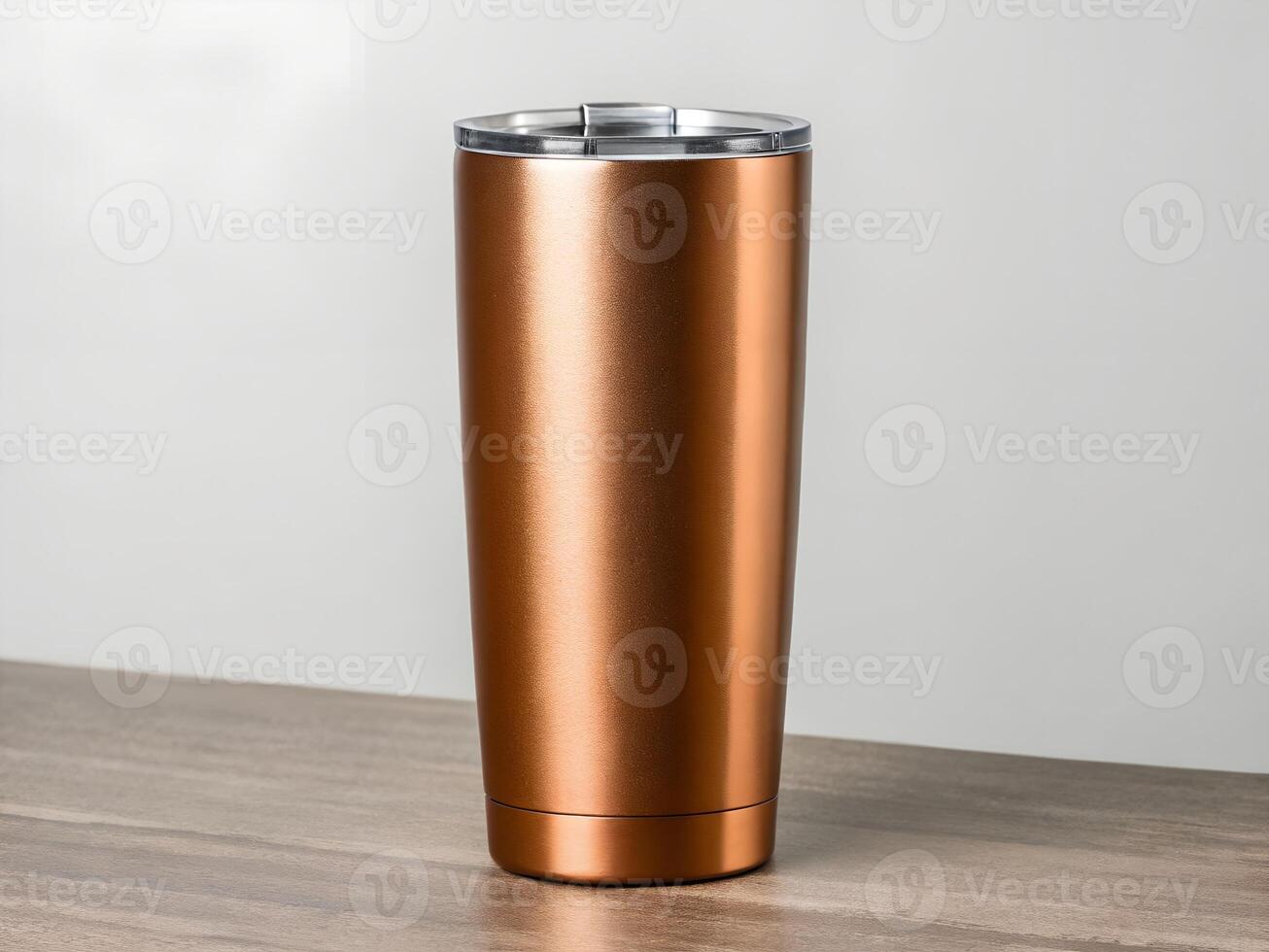 Copper Metallic Tumbler on Brown Wooden Table photo