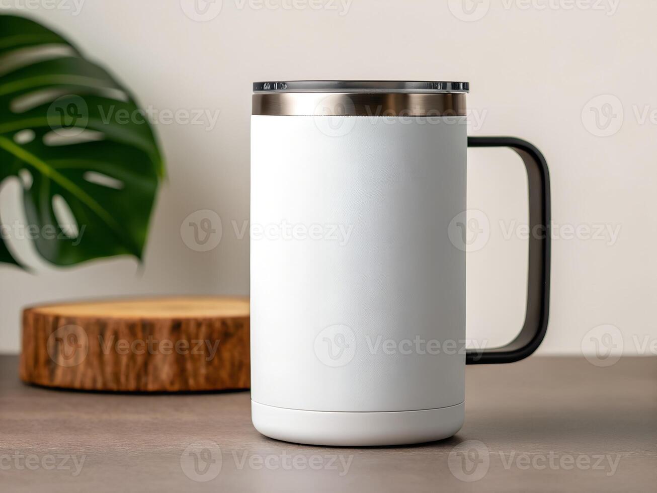 White Stainless Steel Travel Mug with Black Handle on Grey Countertop photo