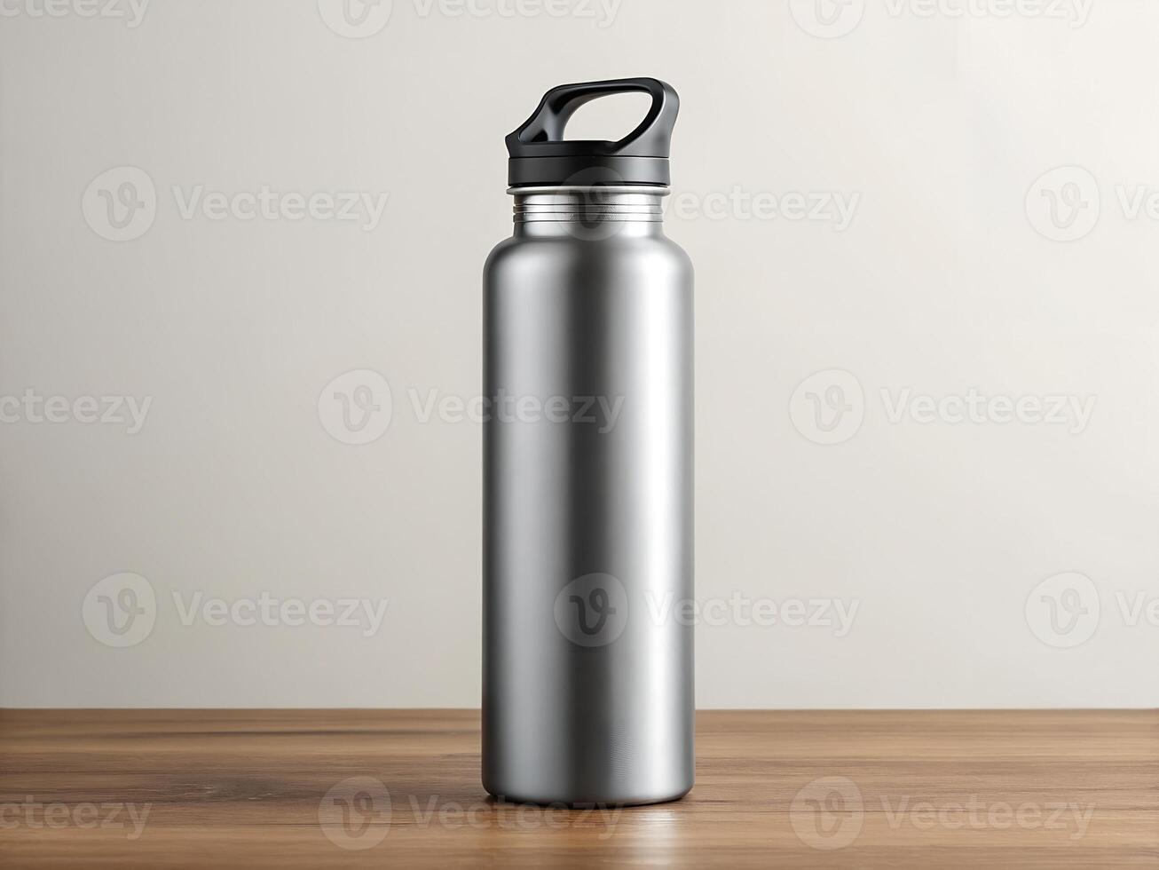 Silver Stainless Steel Water Bottle on Wooden Table photo