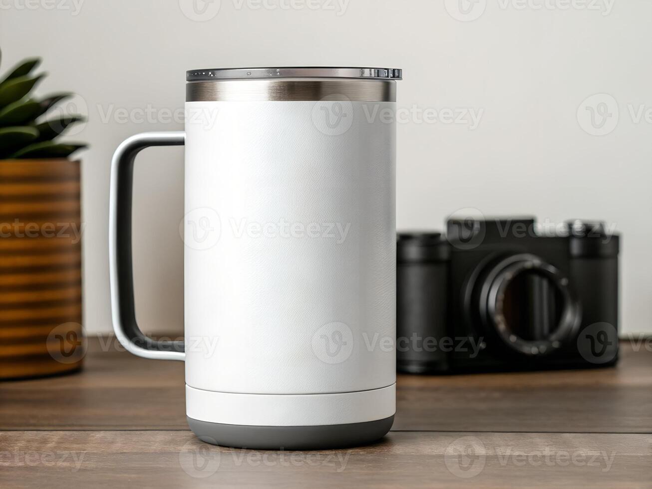 White Stainless Steel Travel Mug with Gray Base on Wooden Table photo