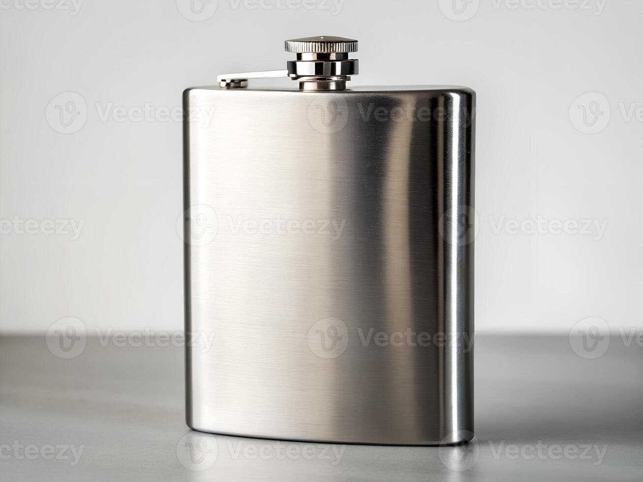 Silver Stainless Steel Flask on Grey Surface photo